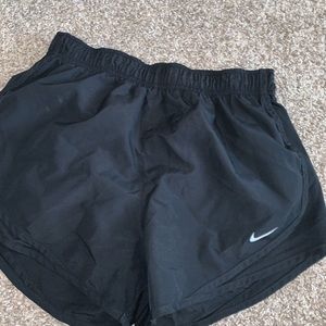 Black Nike running shorts